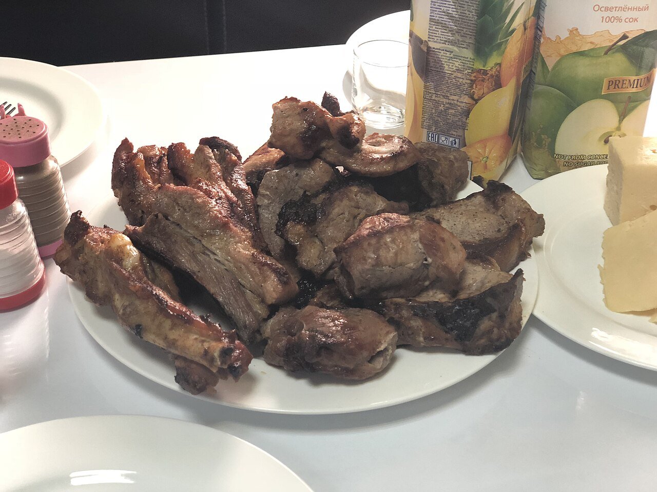 A platter of khorovats, Armenian grilled barbecue, served with cheese on the side