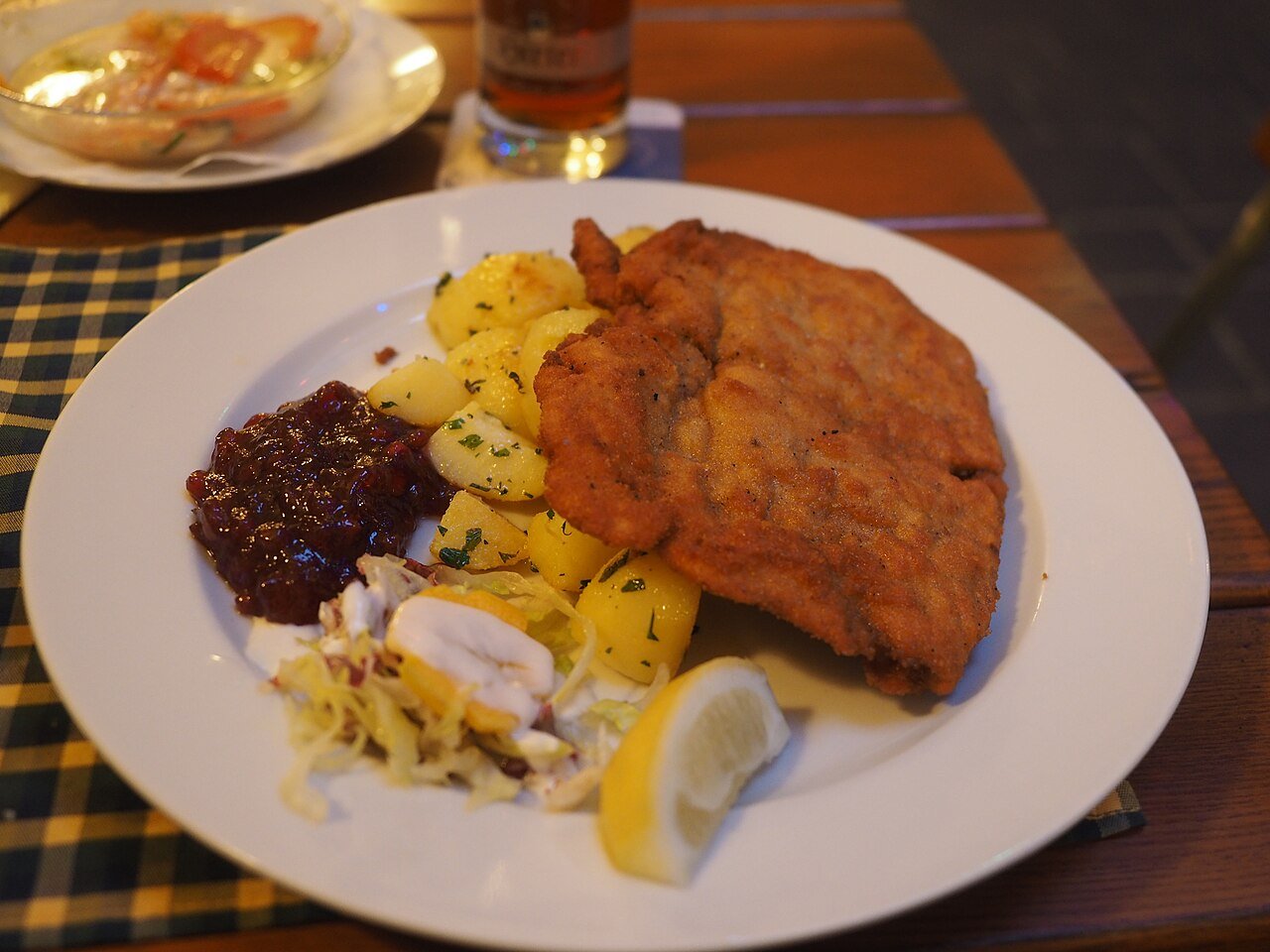 A Wiener Schnitzel served with lemon and cranberries at the Kärtner-Eck restaurant in Klagenfurt, Austria