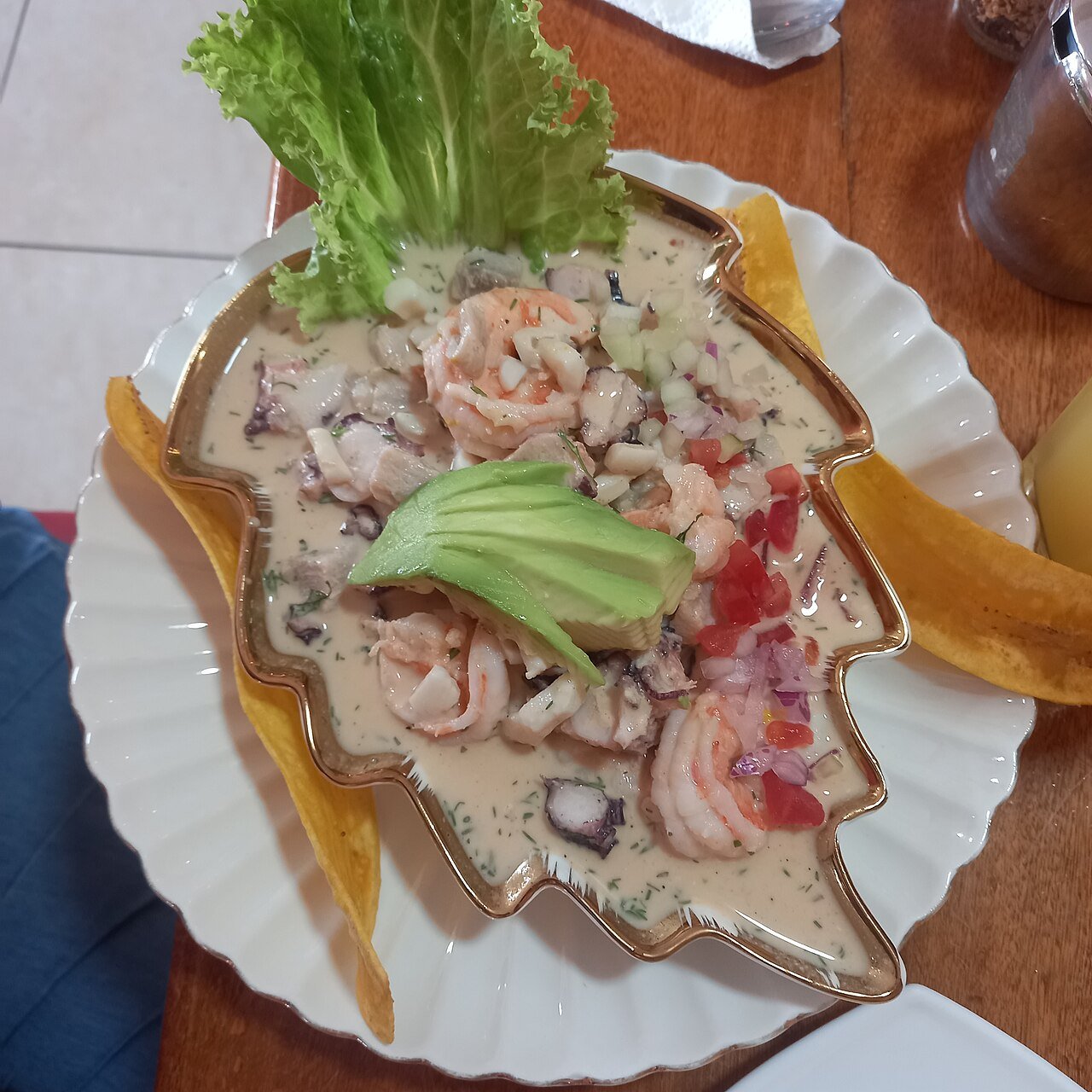 Ecuadorian ceviche manaba — shrimp and fish marinated in citrus with avocado, served with plantain chips