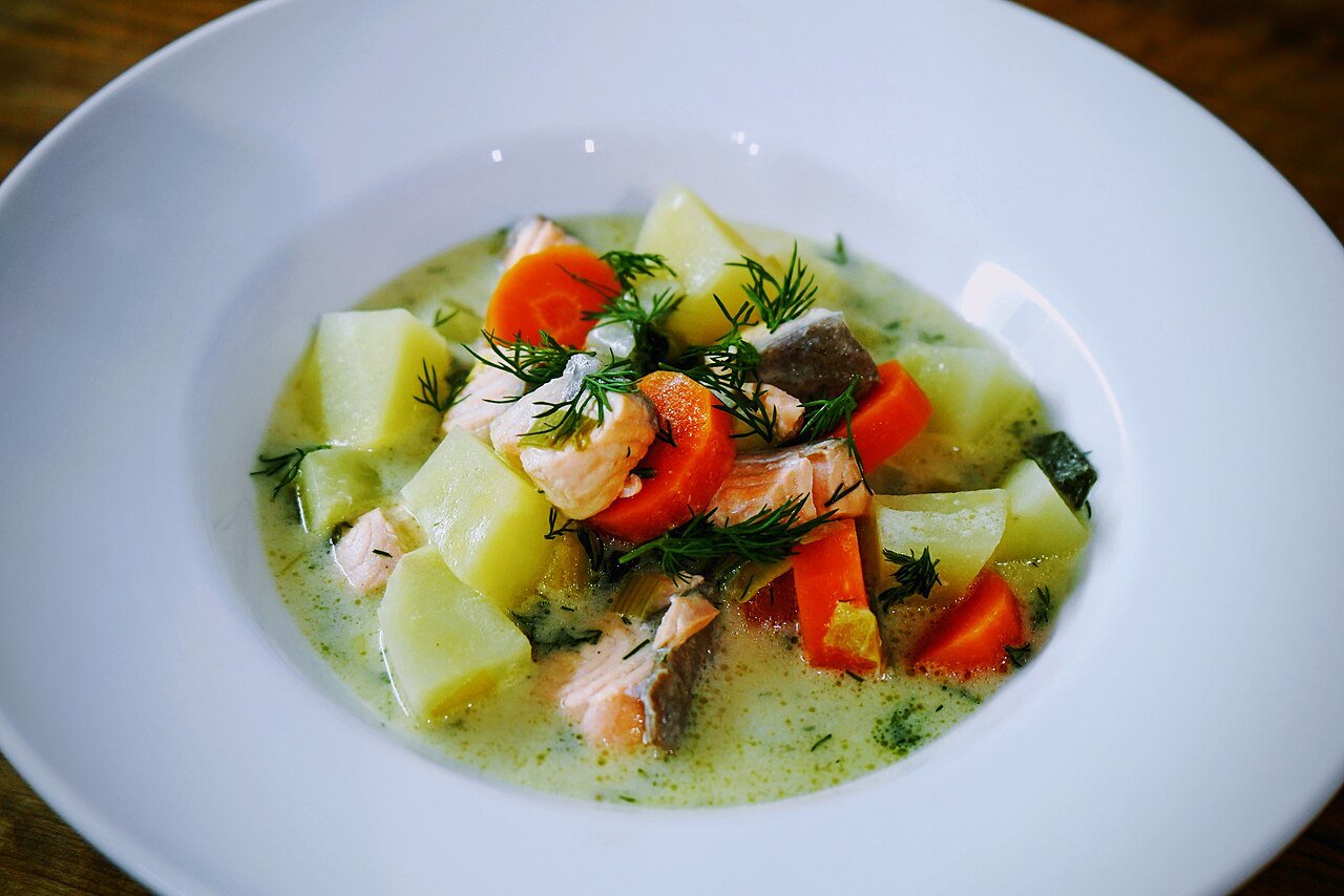 A bowl of lohikeitto, Finland's creamy salmon soup with potatoes, carrots, and dill