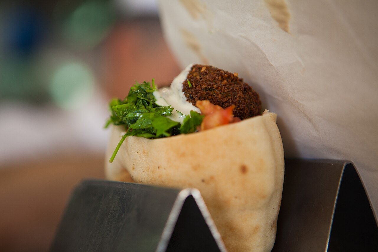 Falafel in a pita with salad and toppings, photographed for the Israeli Ministry of Tourism