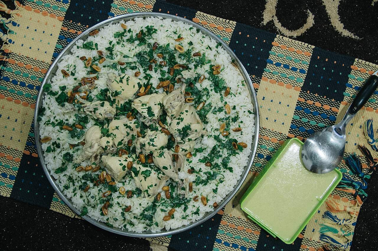 A communal platter of mansaf — lamb and rice with jameed yogurt sauce — Jordan's national dish