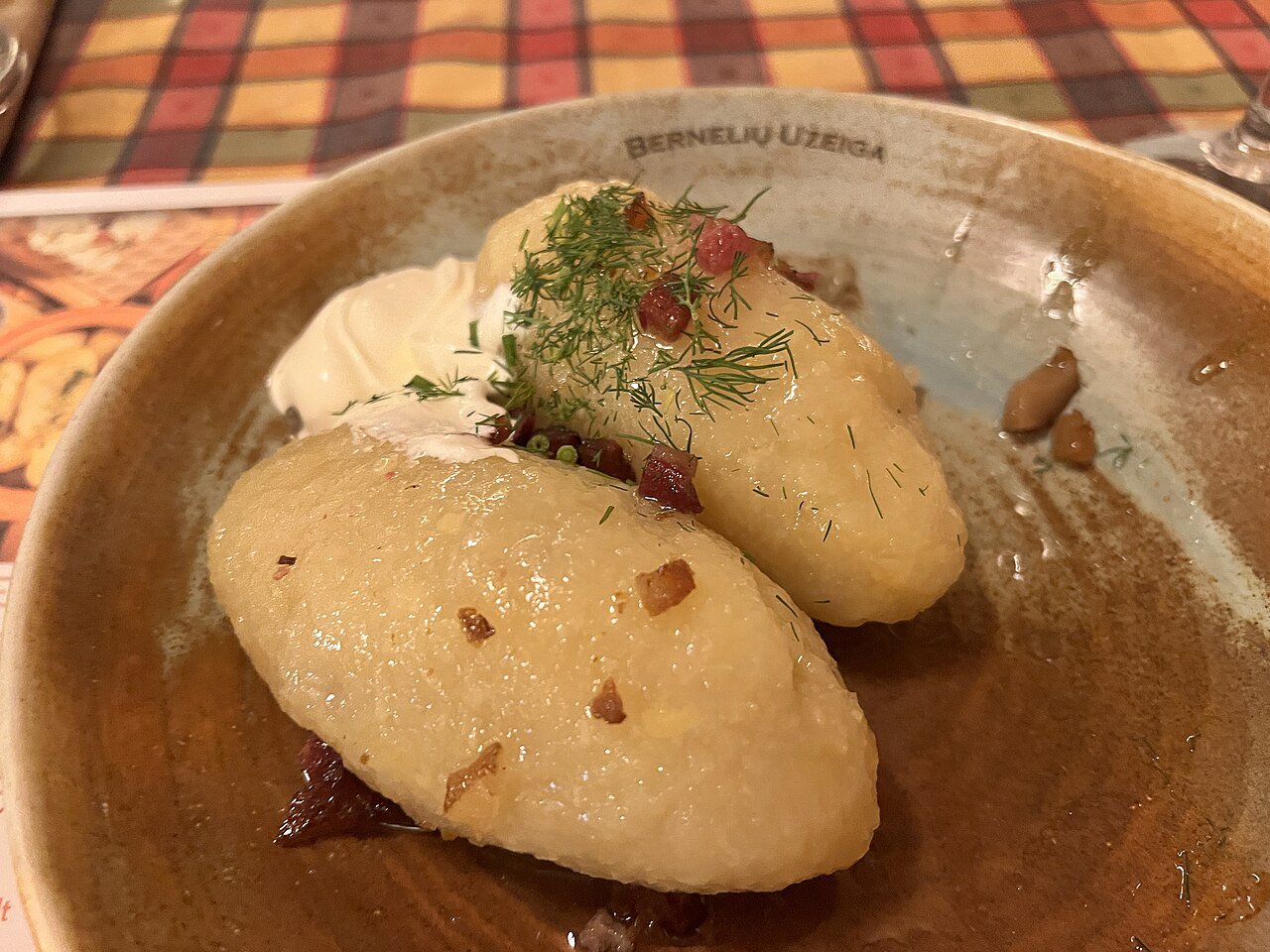 Cepelinai — Lithuania's zeppelin-shaped potato dumplings — served at a restaurant in Kaunas
