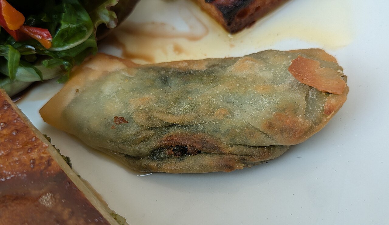 A barbajuan — Monaco's fried chard-and-ricotta pastry — part of a Monégasque assortment at L'Express restaurant in Monaco