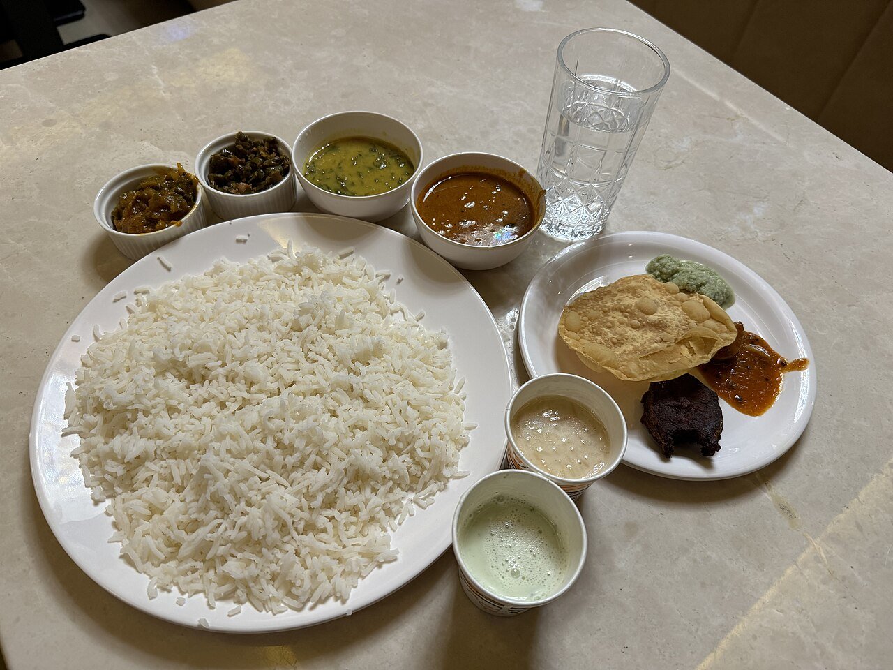 A Nepali khana platter of dal, bhat (rice) and tarkari (curried vegetables) with fish curry