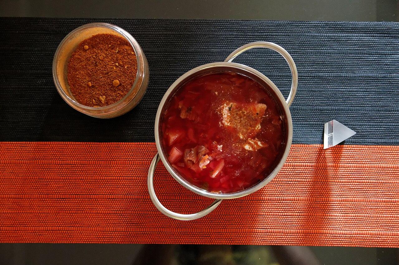 An overhead shot of rich red borscht with sour cream in a pot, in Rostov-on-Don, Russia