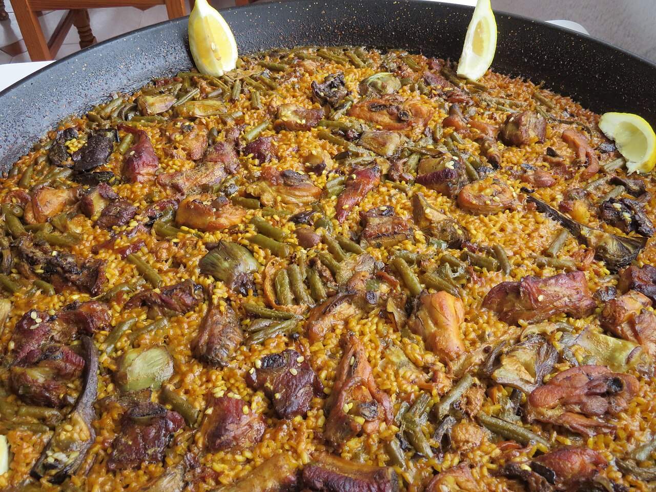 A pan of paella, the iconic rice dish of the Valencian Community, Spain