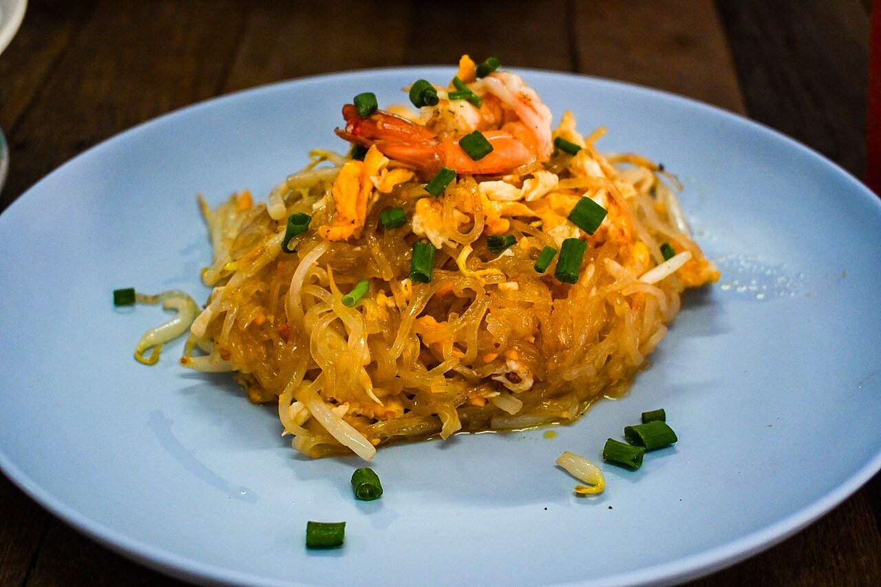 A plate of pad thai with shrimp, bean sprouts and egg, served in Bangkok, Thailand
