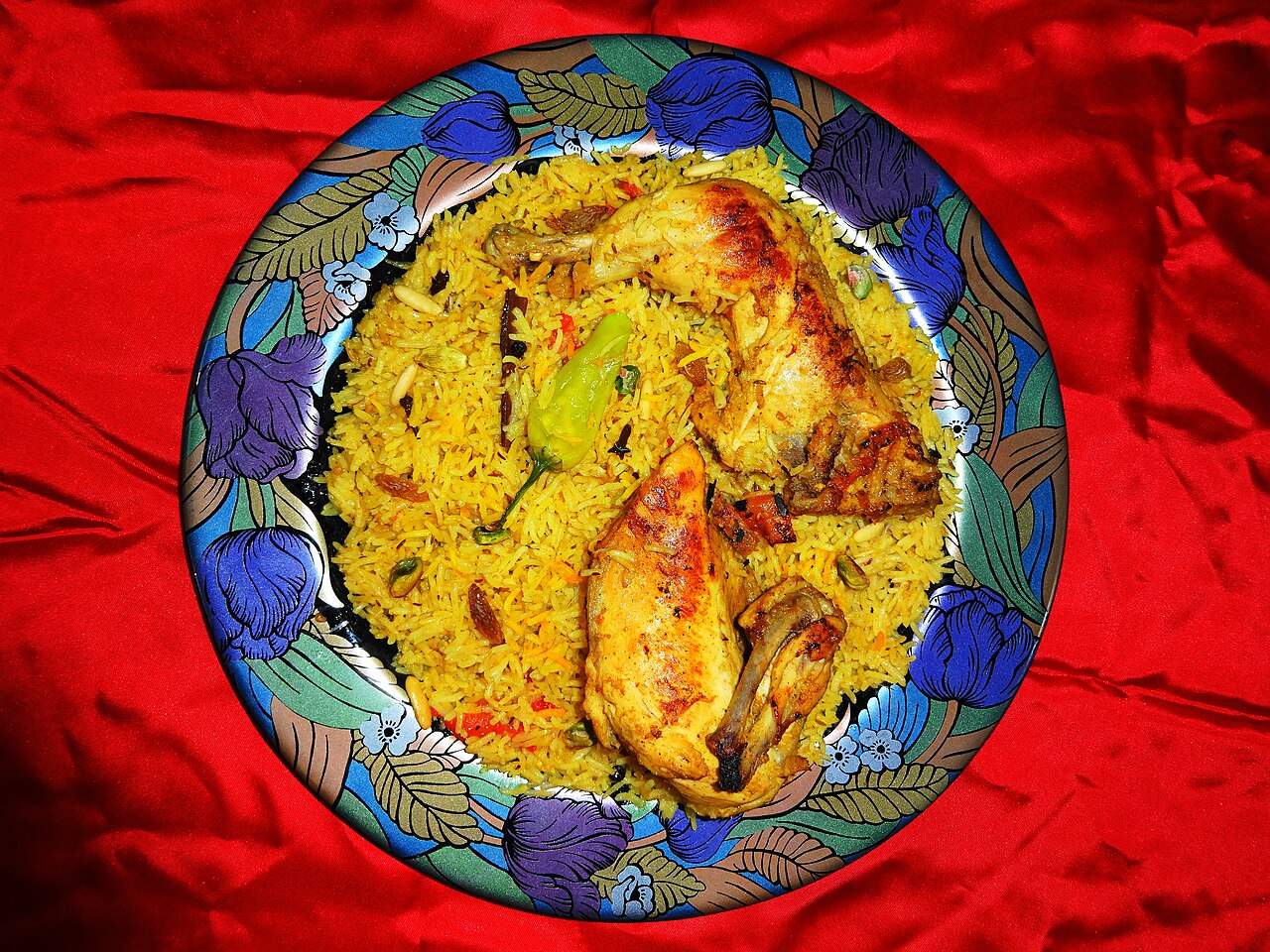 Chicken mandi — the Yemeni dish of fragrant yellow rice with roasted chicken, nuts and raisins