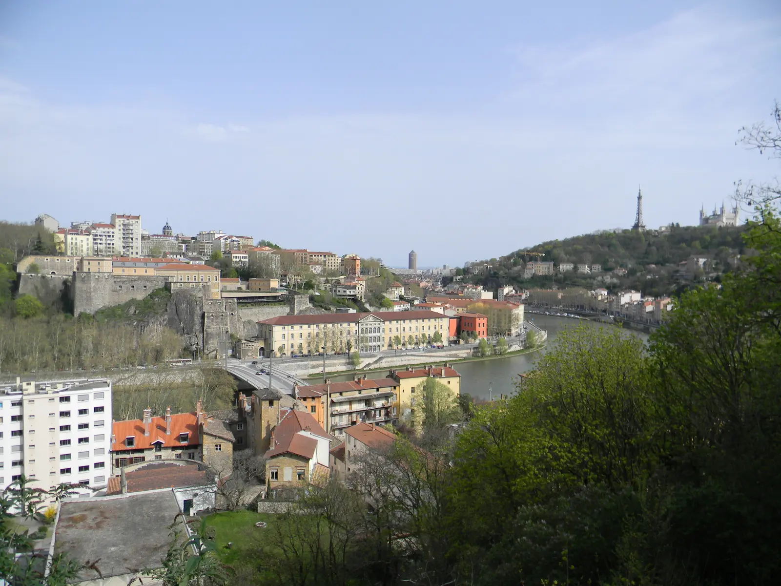 Lyon rooftops and the Saône River viewed from the hill near Fort de Vaise.