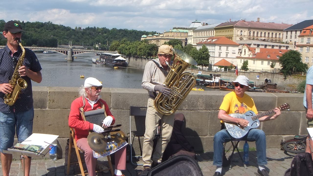 Tourists cross the Charles Bridge in Prague, Czechia