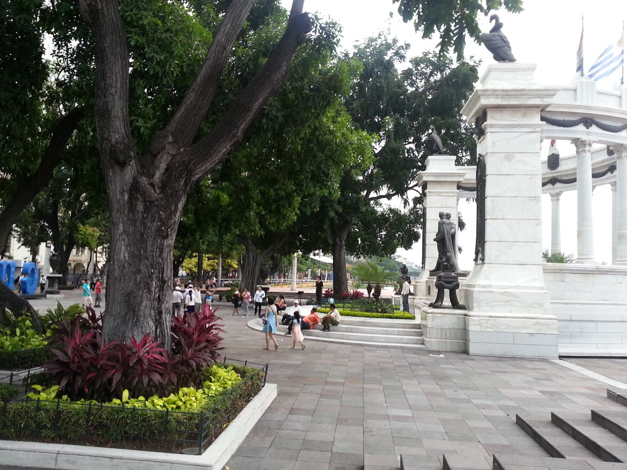 People stroll through the Malecón 2000 riverside plaza in Guayaquil, Ecuador