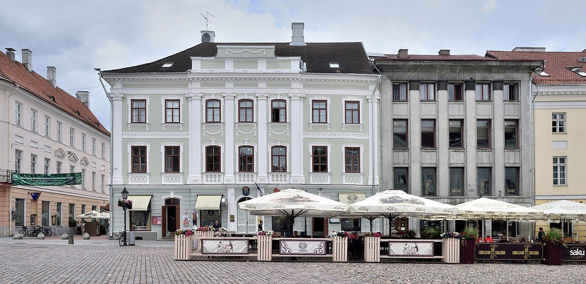 Outdoor café terraces and historic buildings on Town Hall Square in Tartu, Estonia