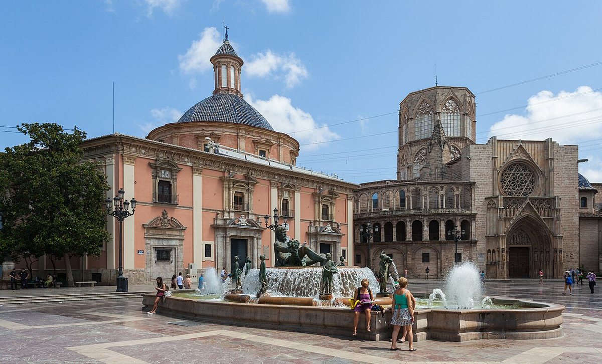 The fountain and historic buildings of Plaza de la Virgen in Valencia, Spain